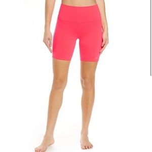 Alo Yoga high waisted biker shorts in Pink Lava